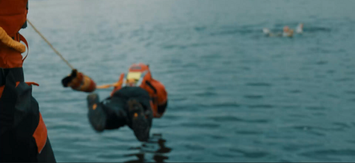 Firefighter jumping into water