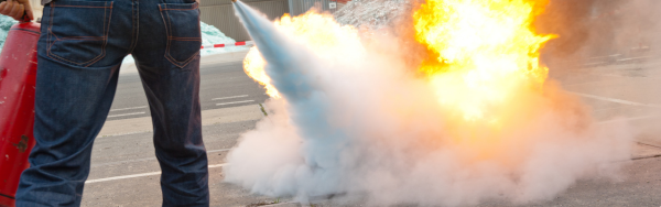 Man operating fire extinguisher