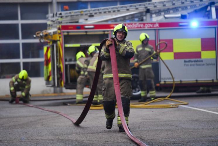 Firefighter holding hose