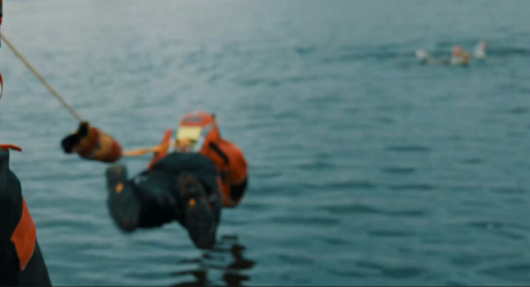 Firefighter jumping into water