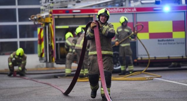 Firefighter holding hose